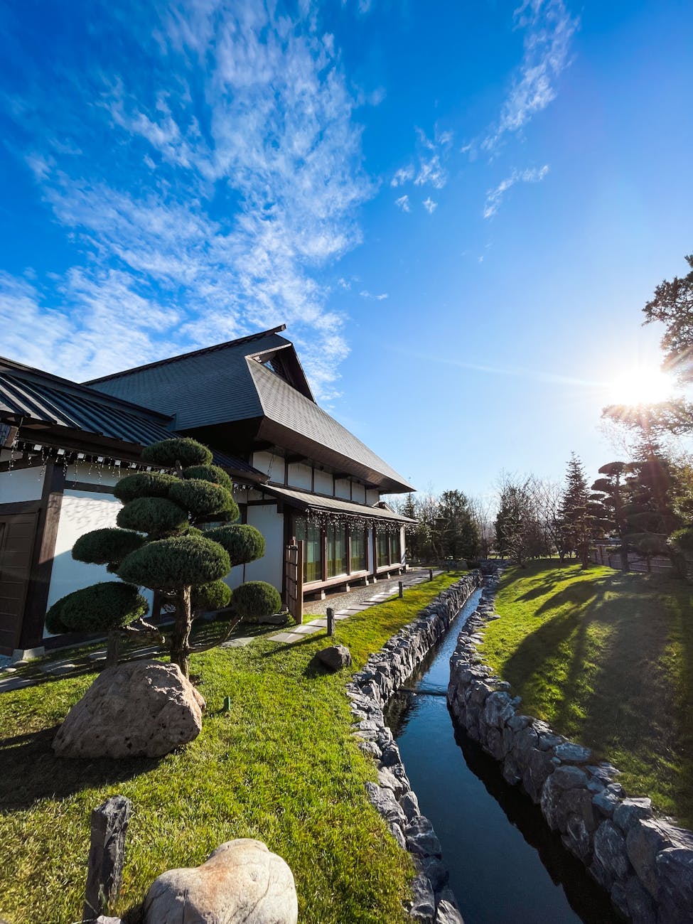 traditional japanese house with garden and stream